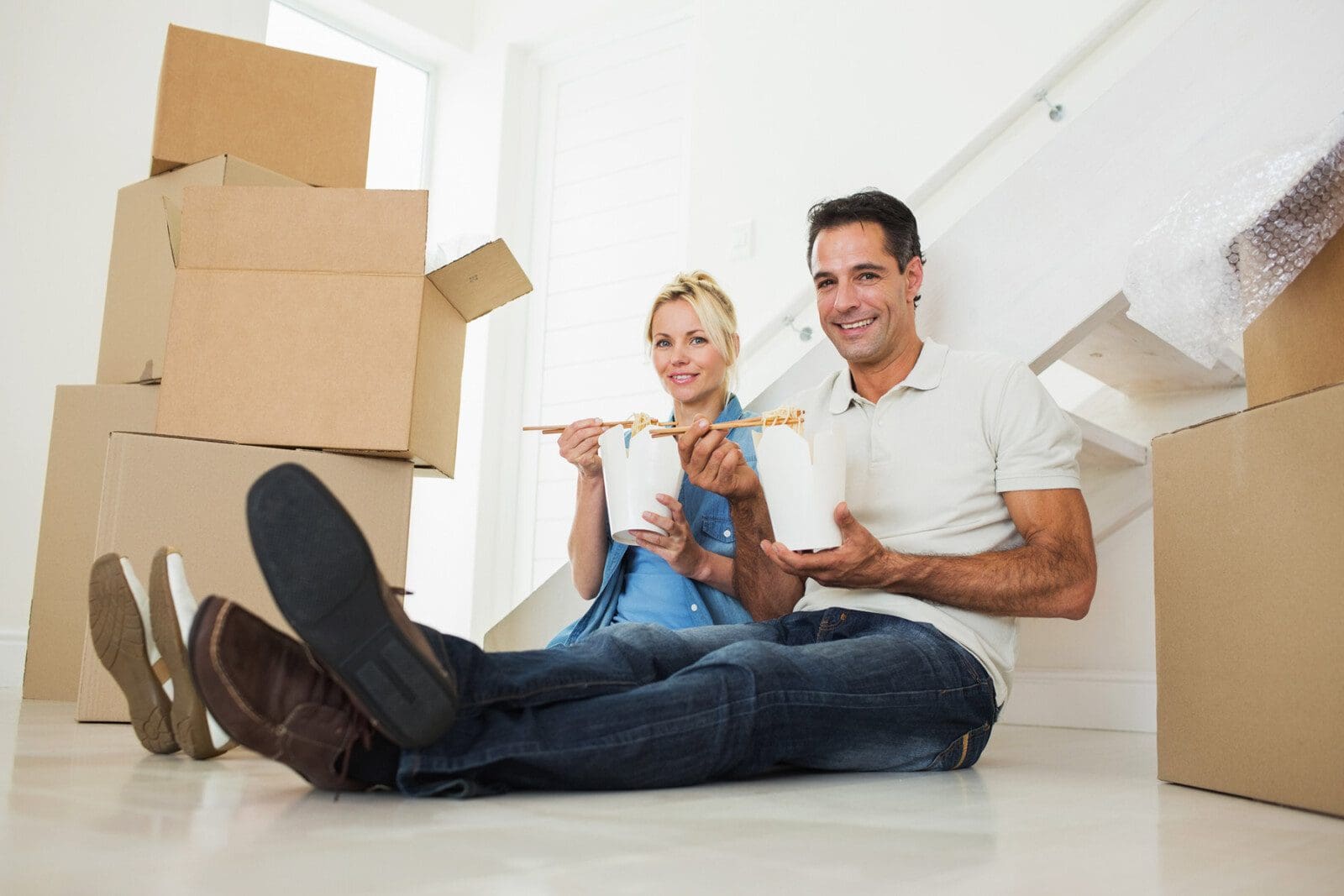Couple-Eating-Noodles-in-a-packed-house Couple-Eating-Noodles-in-a-packed-house