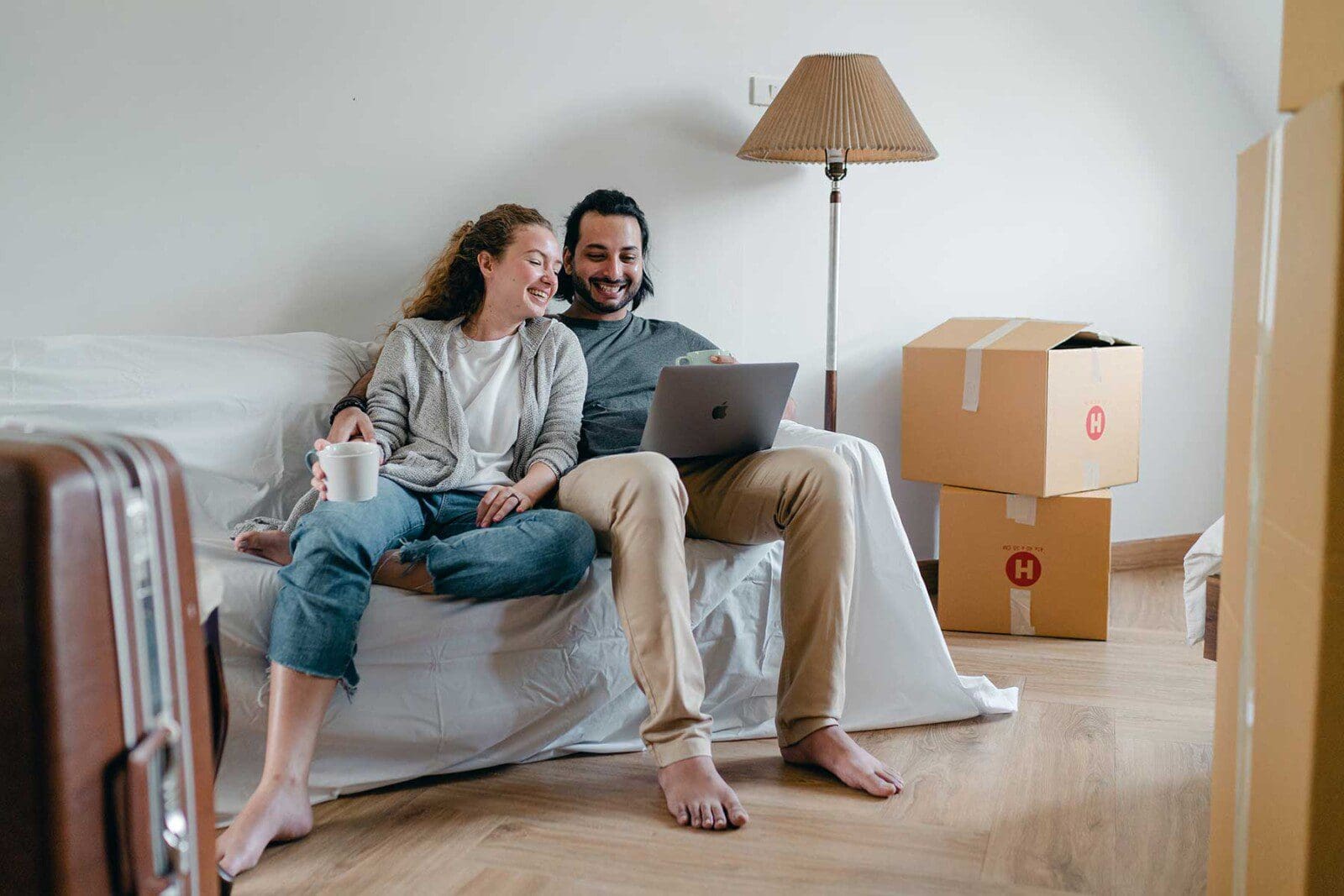 Couple sitting in living room and in the process of moving Couple sitting in living room and in the process of moving